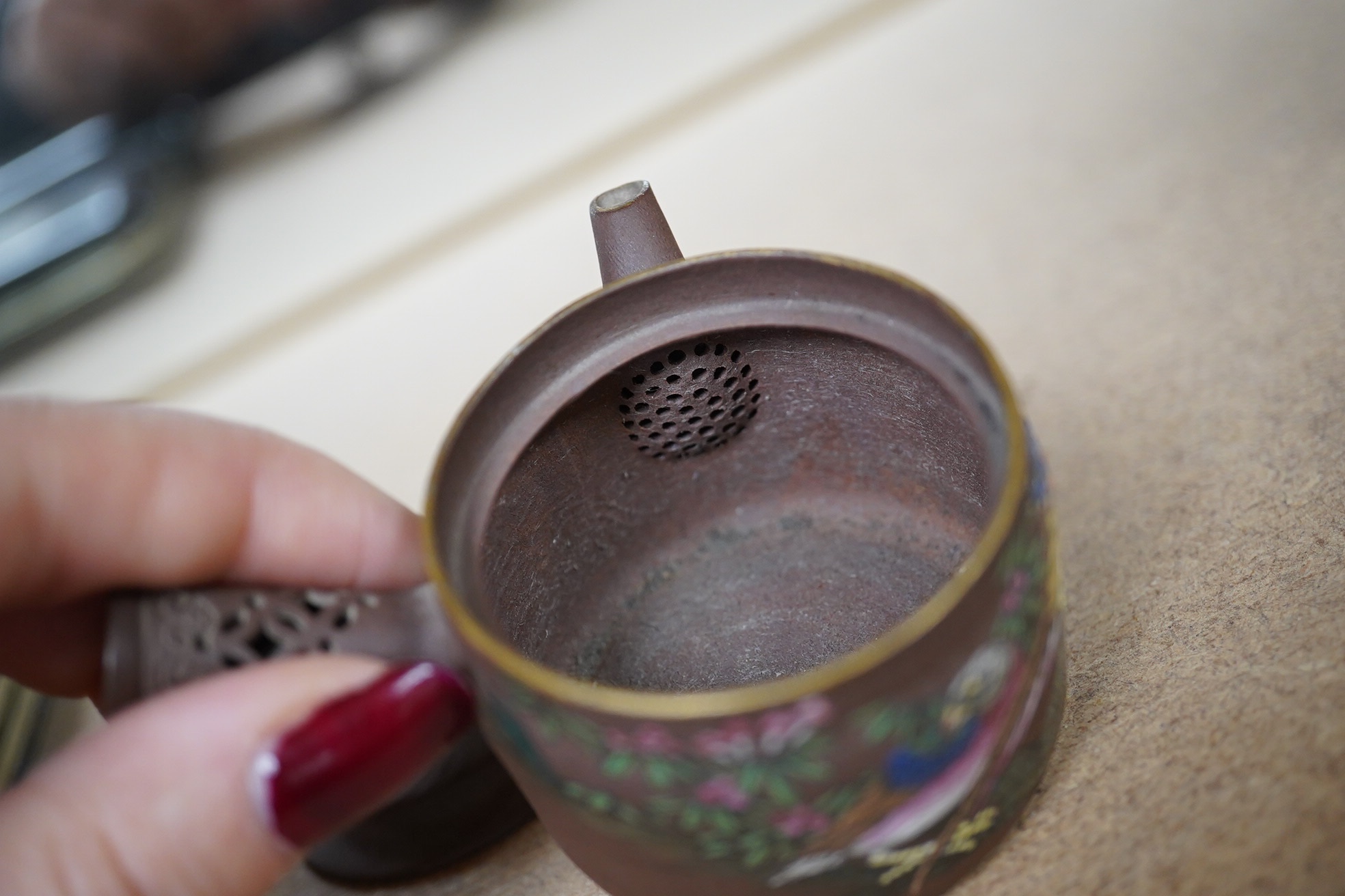 A 19th century Chinese enamelled Yixing miniature teapot, 7.5cm wide. Condition - good